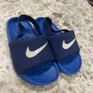 Blue Nike slides